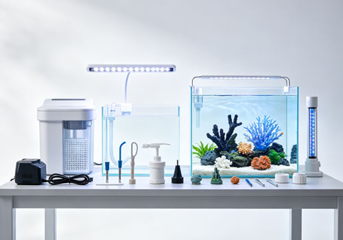Collection of aquarium accessories including filter, light, air pump and aquascaping decorations